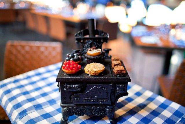 The Petit Four Stove with mini red currant and mini blueberry pies, dark chocolate brownie bites, rainbow cookies and a cookies and cream cupcake, $18